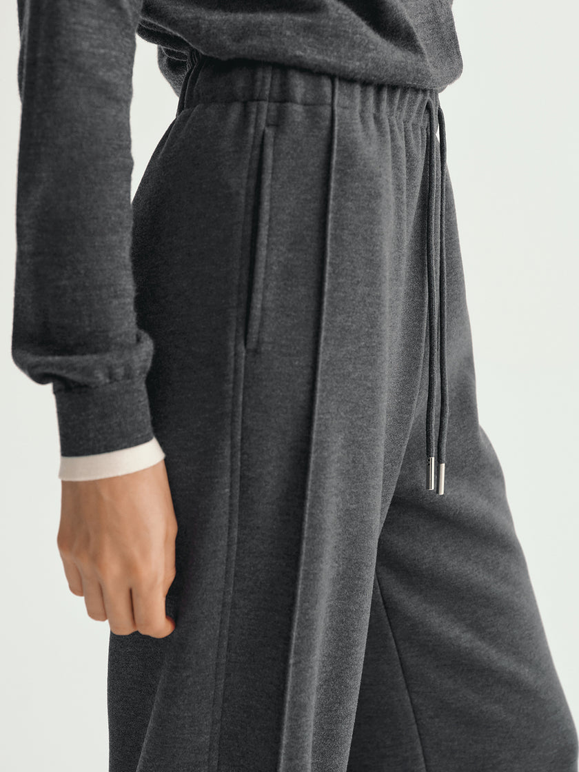 Gray sweatpants with a drawstring on a light gray background