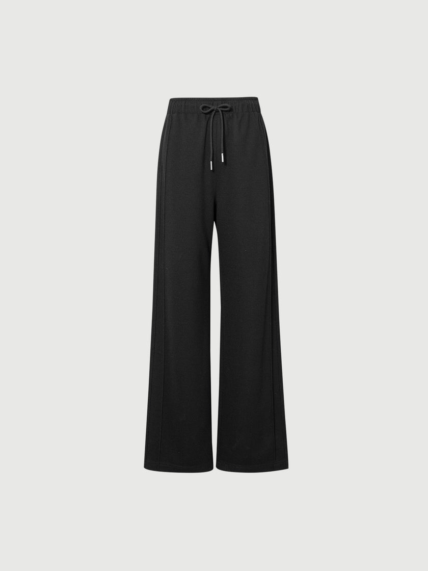 Black wide-leg pants on a light gray background