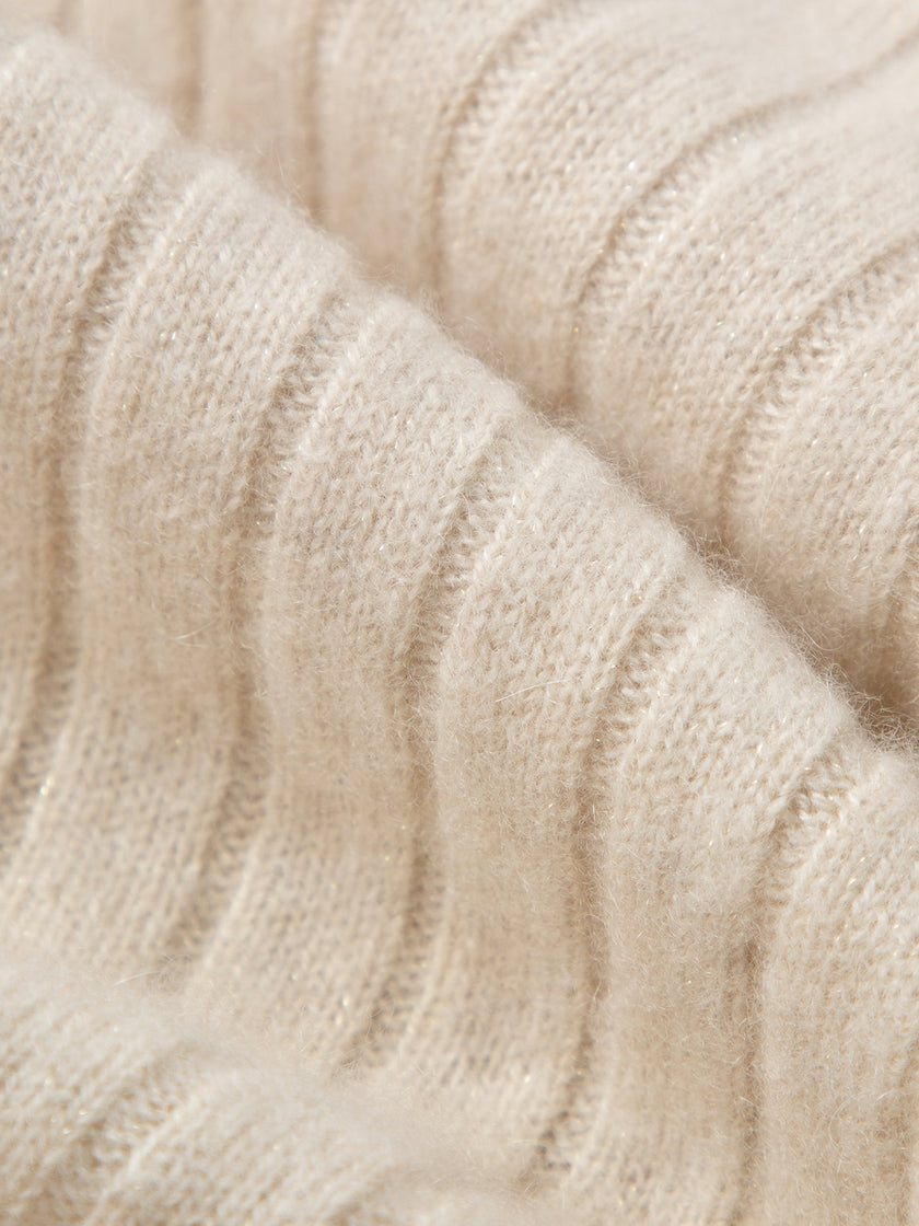 Close-up of beige knitted fabric texture