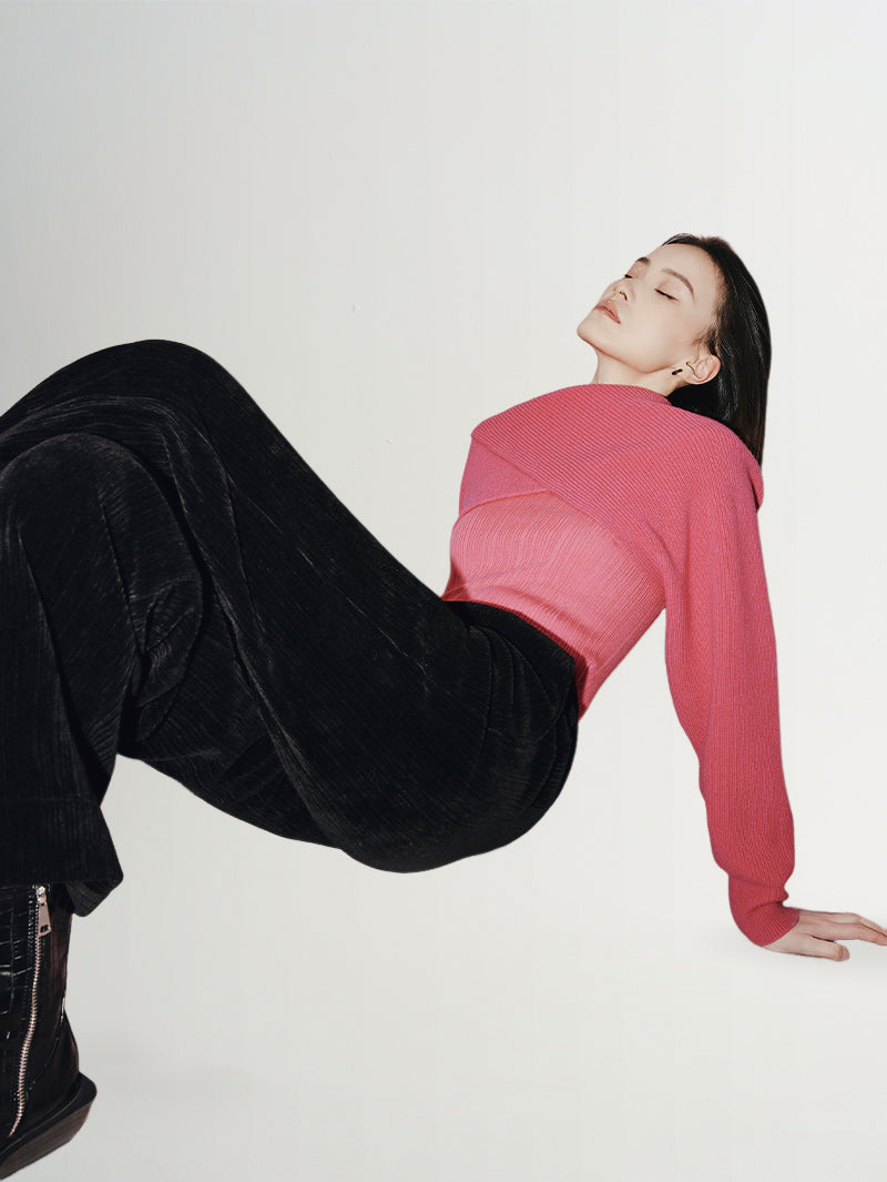 Model wearing Wide Leg Trousers with a pink top, showcasing a stylish and comfortable outfit.