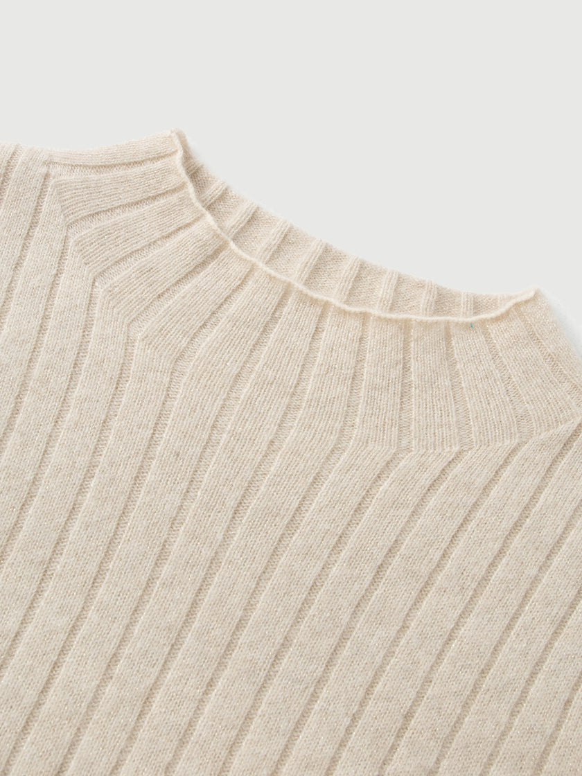 Close-up of a beige ribbed sweater on a light gray background