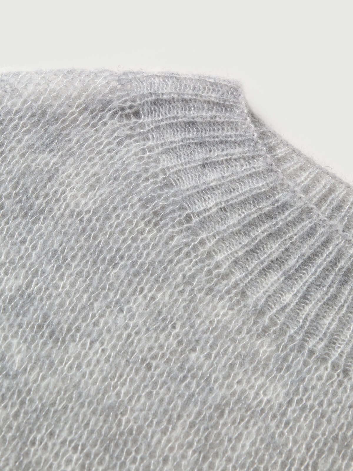 Close-up of the collar of a Cashmere-Silk Relaxed Pullover Sweater in light gray.