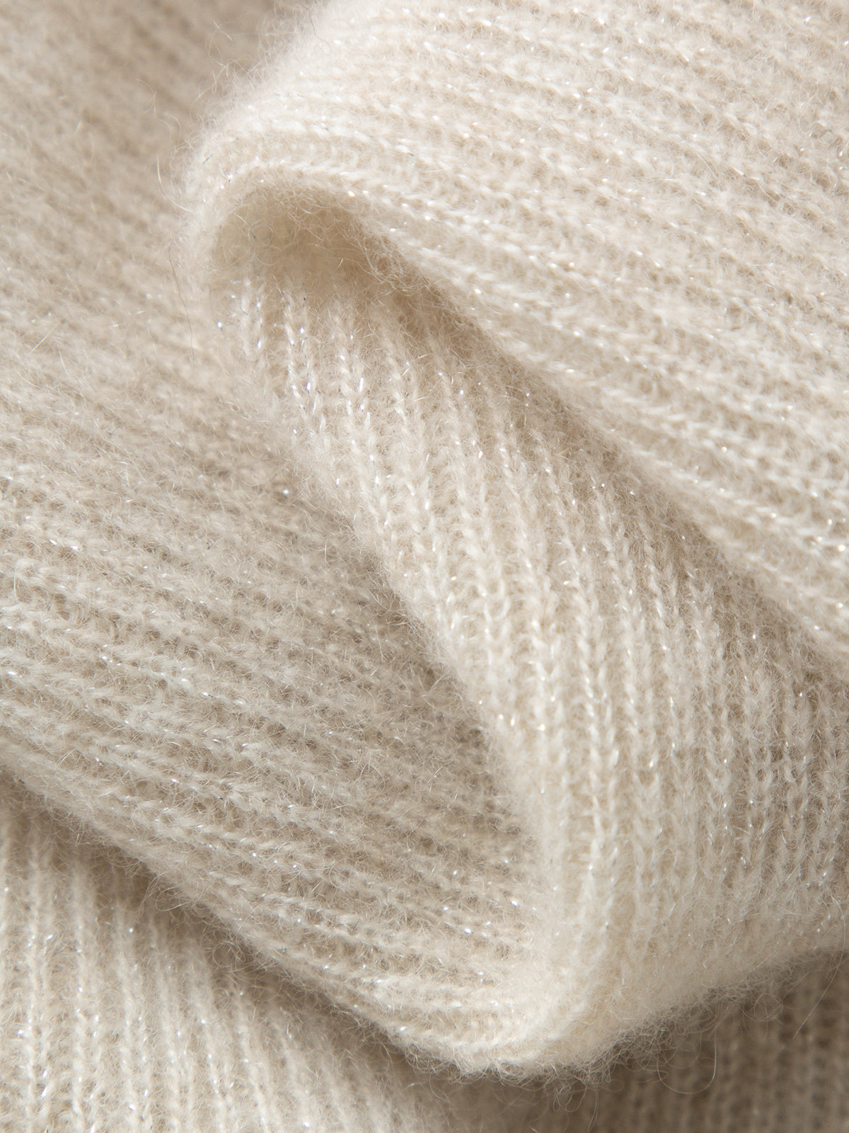 Close-up of beige knitted fabric