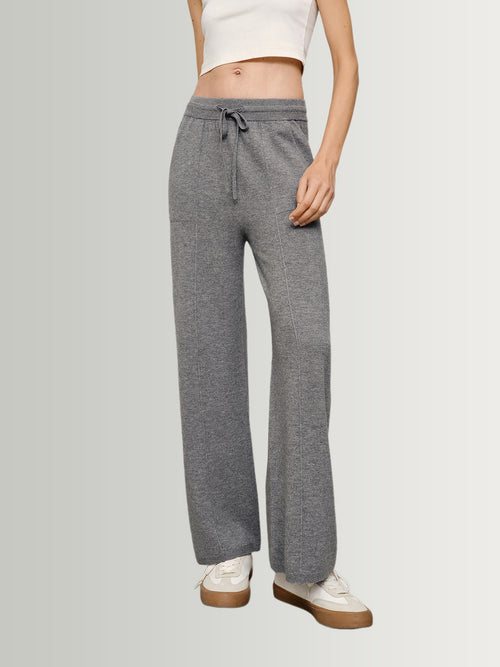 Load image 1 in gallery view. Person wearing gray drawstring pants on a plain background