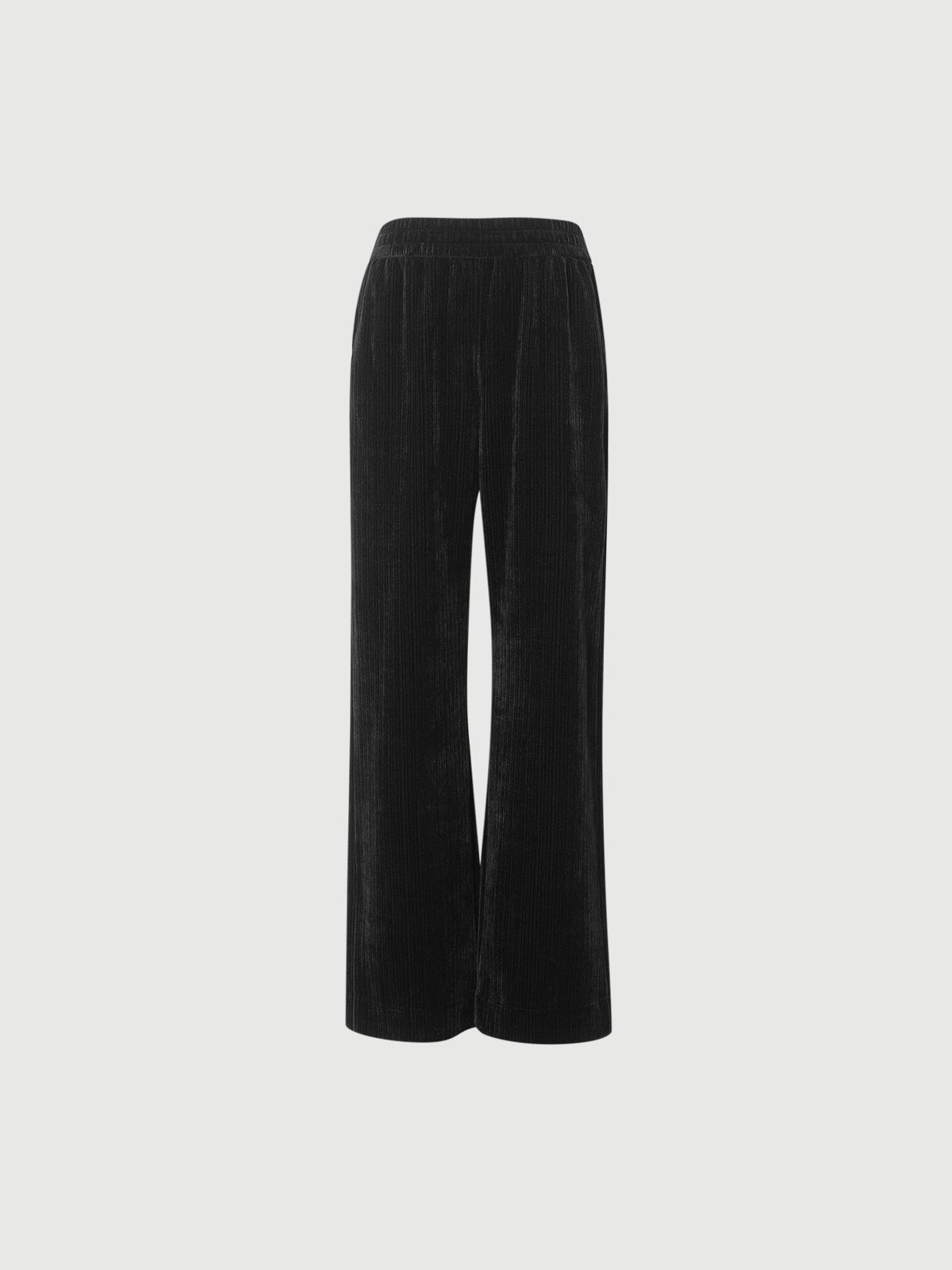 Black velvet pants on a light gray background