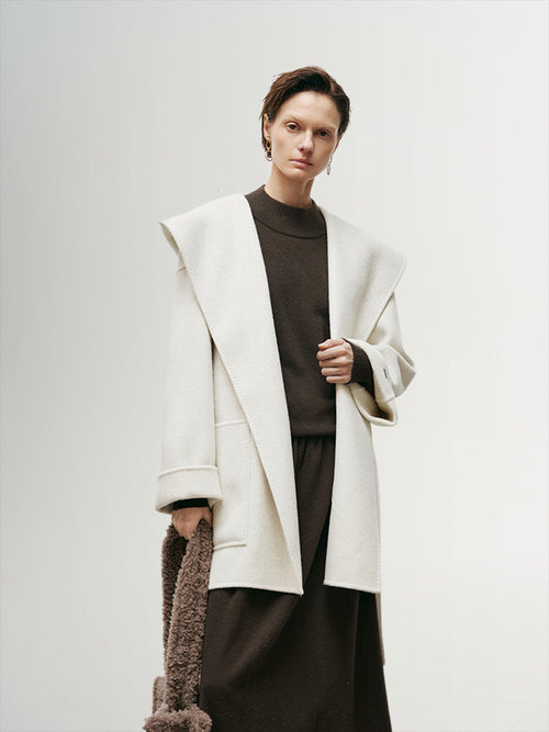 Load image 1 in gallery view. Women's White Oversized Hood Wool Coat, designed with a large hood and soft wool fabric, offering warmth and style for colder seasons.