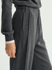 Gray sweatpants with a drawstring on a light gray background