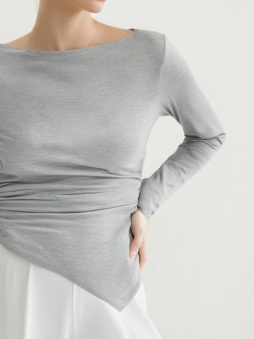 Load image 1 in gallery view. Gray long-sleeve top worn by a person on a white background