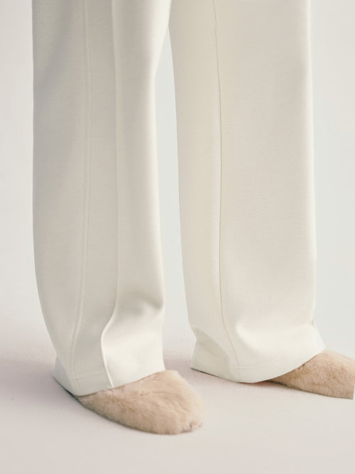 Load image 1 in gallery view. White pants worn by a person on a light gray background