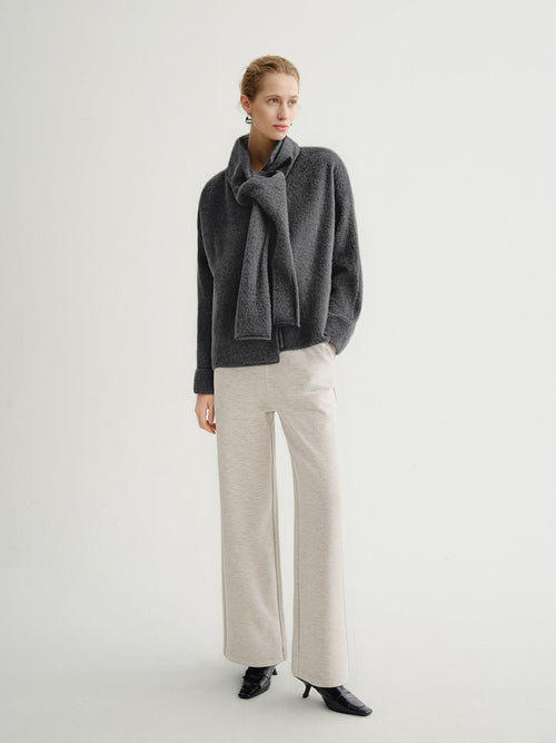 Load image 1 in gallery view. Woman wearing a gray sweater and beige pants