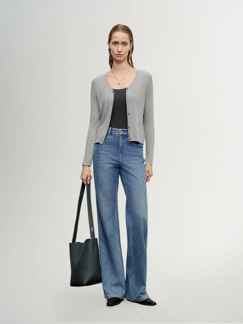 Load image 1 in gallery view. MEILLEUR MOMENT Indigo Blue Flared Jeans -  On Model Styled with Gray Thin Cardigan