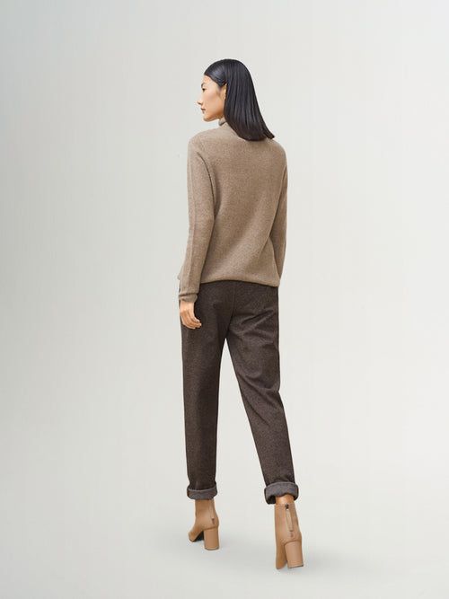 Load image 1 in gallery view. Back view of a model wearing a Camel Slim Fit Cashmere Sweater, stylishly paired with tailored pants.
