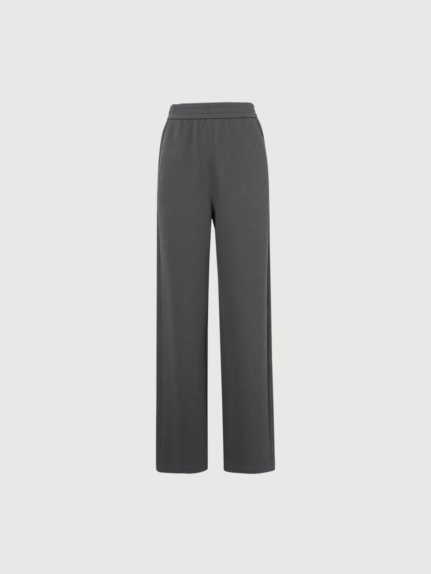 Dark gray pants on a light gray background