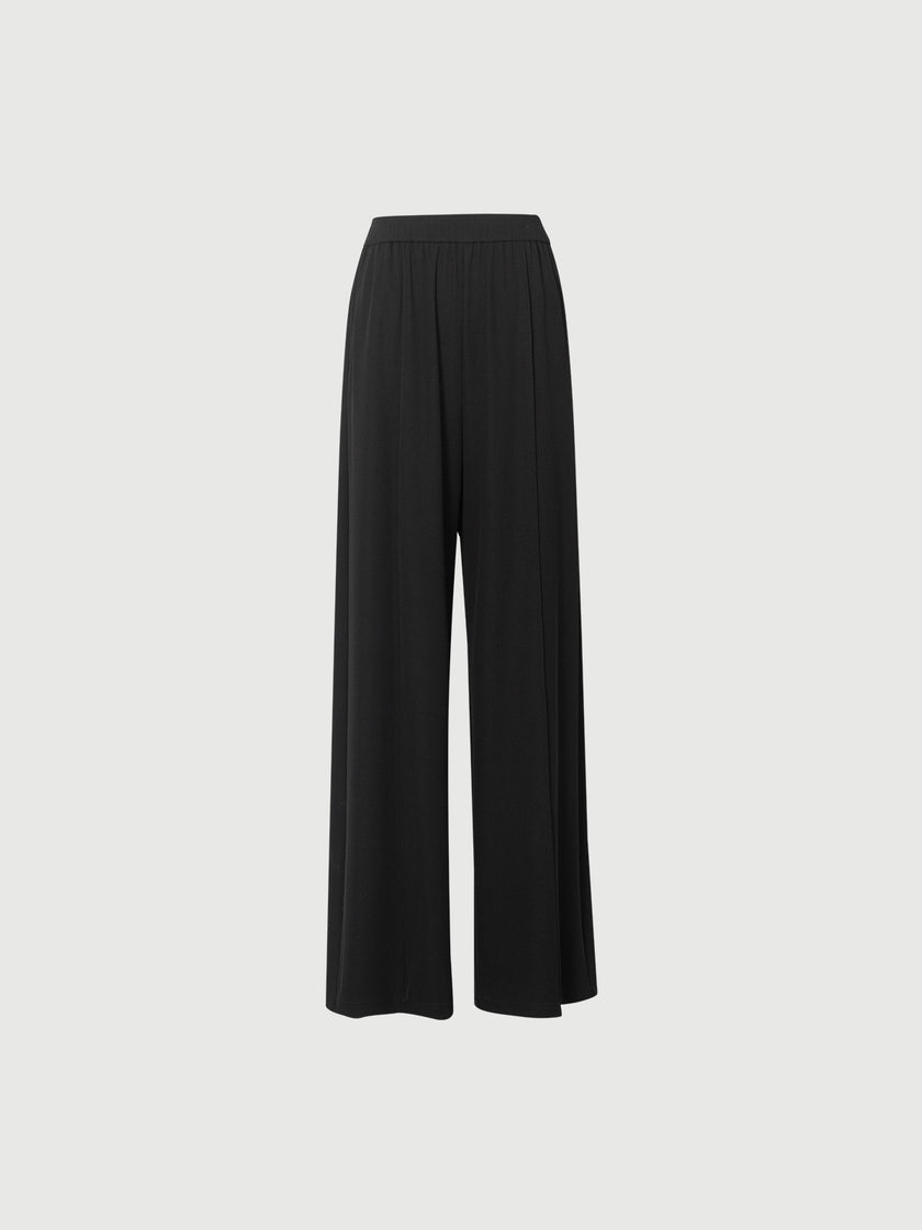 Black wide-leg pants on a light gray background