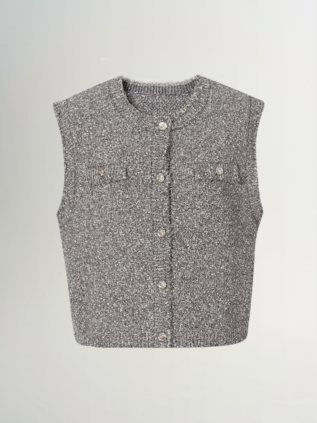 Tweed knit vest in gray, featuring button closure and pocket details, perfect for layering and casual wear.