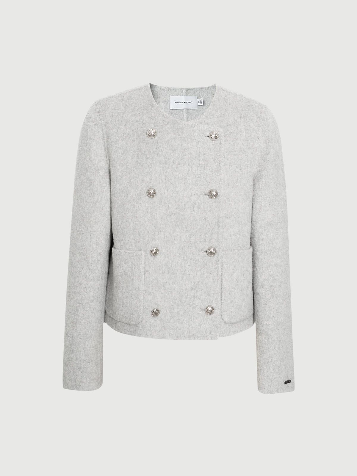 Light gray blazer with button details on a white background
