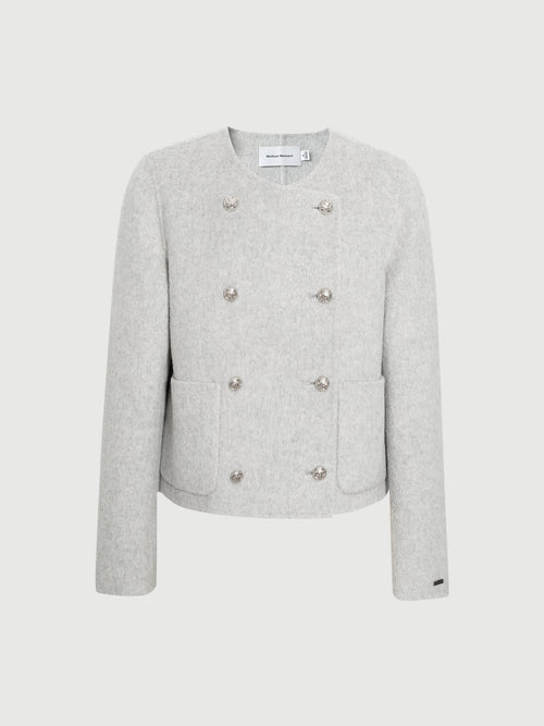 Load image 1 in gallery view. Light gray blazer with button details on a white background