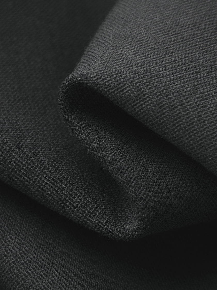 Close-up of dark gray fabric with a textured surface