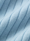Close-up of textured blue fabric with horizontal lines