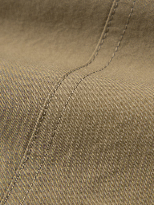 Load image 1 in gallery view. Close-up of brown fabric with stitching detail