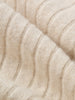 Close-up of beige knitted fabric texture
