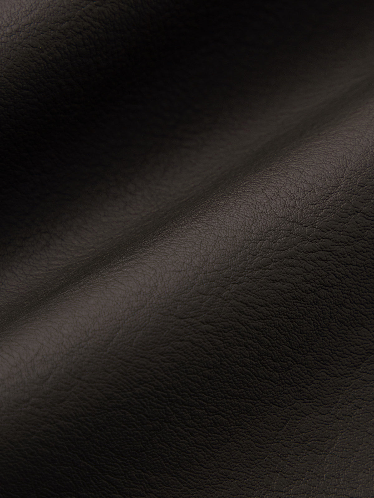 Close-up of dark brown leather texture
