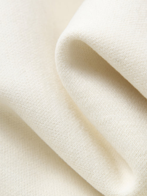 Load image 1 in gallery view. Close-up of beige fabric with a soft texture