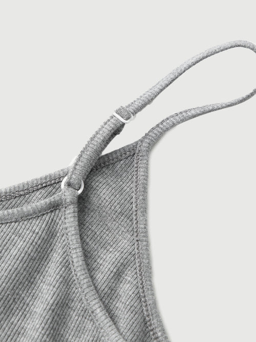 Load image 1 in gallery view. Close-up of a textured gray fabric with a strap on a light gray background