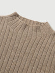 Close-up of a brown ribbed knit sweater on a light gray background