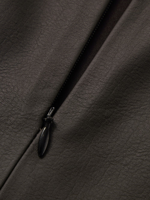 Load image 1 in gallery view. Close-up of a black zipper on dark brown leather fabric