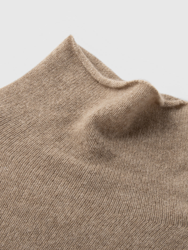 Camel Slim Fit Cashmere Sweater showcasing soft cashmere fabric and turtleneck design. Perfect for layering.