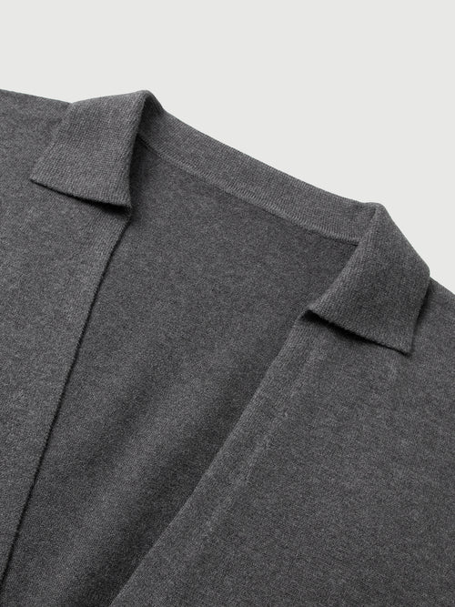 Load image 1 in gallery view. Close-up of a gray sweater with a collar on a light gray background