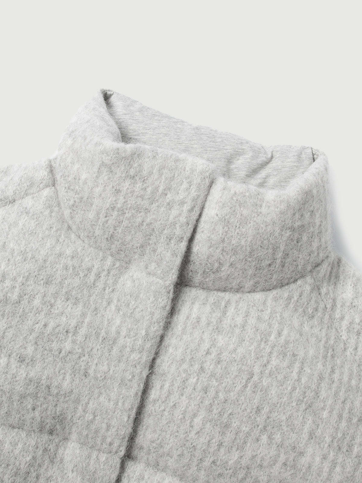 Close-up of a textured gray fabric with a light background