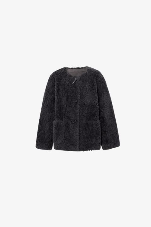 Load image 1 in gallery view. Black fluffy jacket on a white background