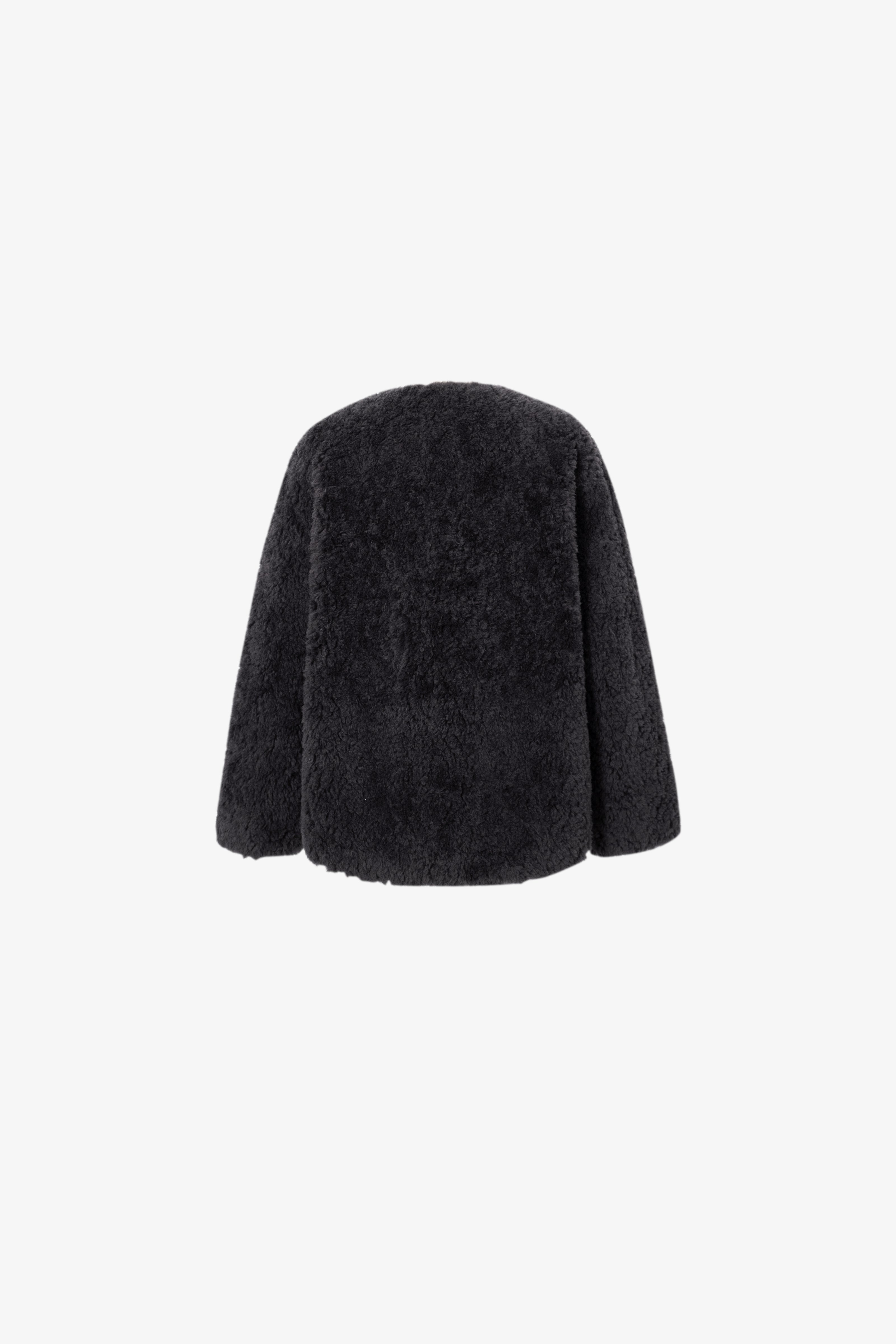 Black fur coat on a white background