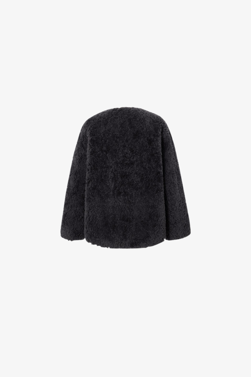 Black fur coat on a white background