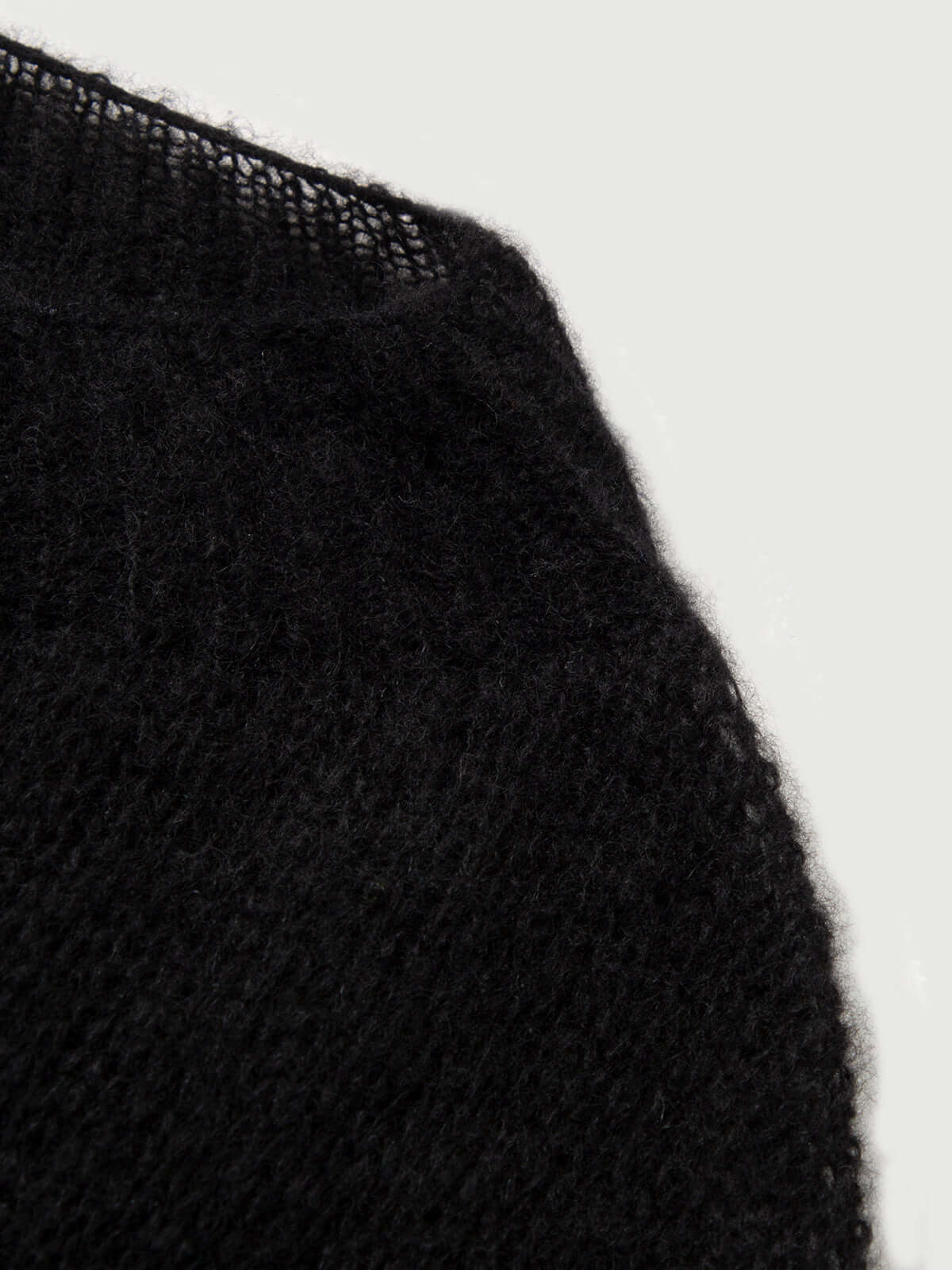 Close-up of the fabric of the Cashmere-Silk Relaxed Pullover Sweater showcasing its soft texture and knit detail.
