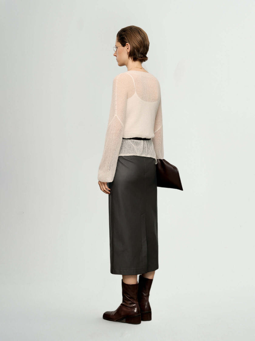 Woman wearing a Cashmere-Silk Relaxed Pullover Sweater with a long skirt and boots, showcasing soft elegance.