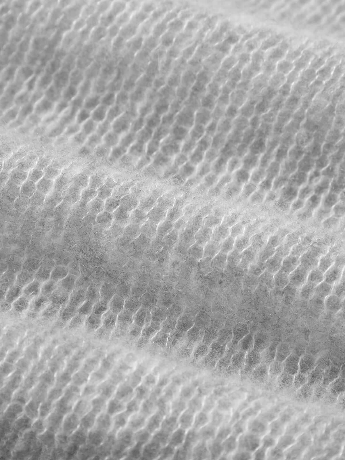Close-up texture of cashmere and silk blend fabric for Cashmere-Silk Relaxed Pullover Sweater.