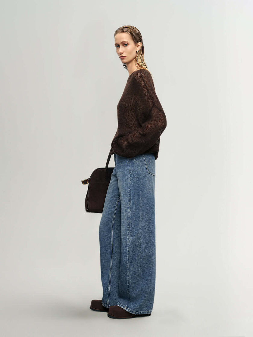 Cashmere-Silk Relaxed Pullover Sweater worn with wide-leg jeans and a shoulder bag, showcasing soft texture and elegance.
