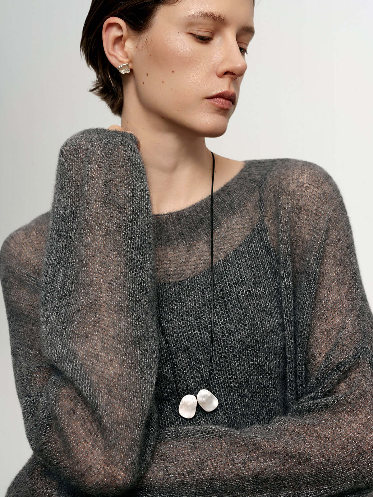 Cashmere-Silk Relaxed Pullover Sweater in soft fabric worn by model, showcasing elegant style and relaxed fit.