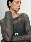 Cashmere-Silk Relaxed Pullover Sweater in soft fabric worn by model, showcasing elegant style and relaxed fit.