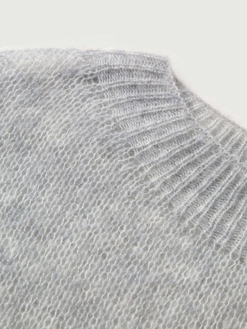 Load image 1 in gallery view. Close-up of the collar of a Cashmere-Silk Relaxed Pullover Sweater in light gray.
