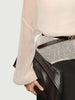 Cashmere-Silk Relaxed Pullover Sweater with a sleek belt and a stylish clutch in a casual outfit.
