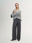 Model wearing a Cashmere-Silk Relaxed Pullover Sweater with wide-leg trousers, showcasing a relaxed and elegant style.