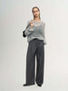 Model wearing a Cashmere-Silk Relaxed Pullover Sweater with wide-leg trousers, showcasing a relaxed and elegant style.