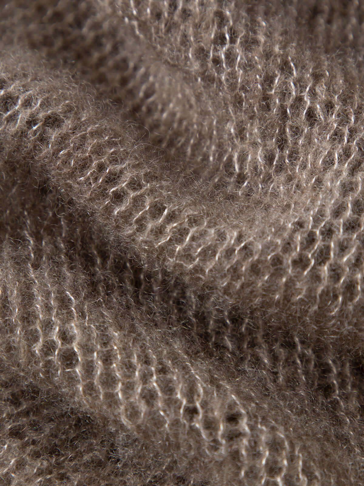 Close-up of soft knit fabric showcasing Cashmere-Silk Relaxed Pullover Sweater texture.