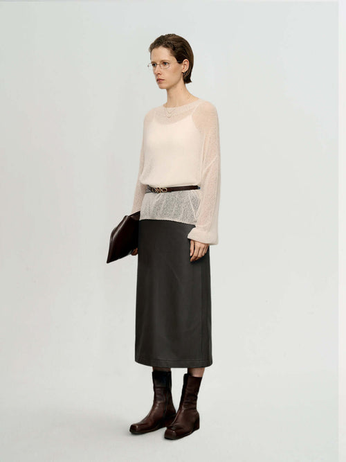 Load image 1 in gallery view. Cashmere-Silk Relaxed Pullover Sweater worn with a dark skirt, showcasing its elegant drape and versatile styling.