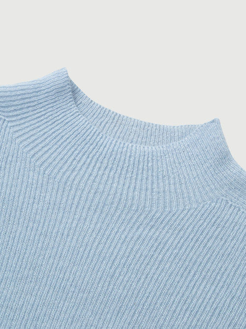 Load image 1 in gallery view. Close-up of a light blue ribbed sweater on a light gray background
