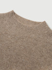 Close-up of a brown ribbed knit sweater collar on a light gray background